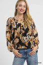 Black mix balloon sleeve blouse with autumn leaf print by Umgee, featuring stylish design and lightweight fabric.