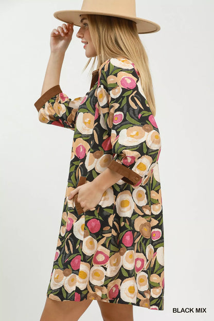 Black Umgee floral contrast trim shift mini dress with a relaxed fit, featuring a stylish floral pattern and contrast details.