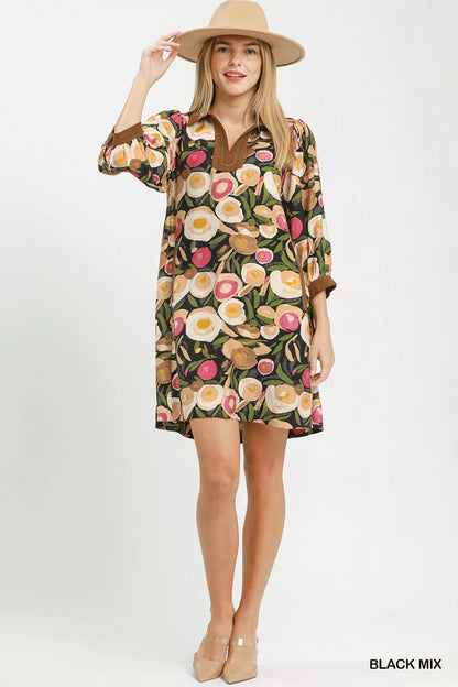 Black Umgee floral contrast trim shift mini dress with a relaxed fit, featuring a stylish floral pattern and contrast trim details.
