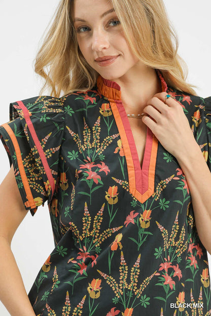 Black Umgee floral print blouse with contrast trim, stylish mix of patterns, short sleeves, and relaxed fit.