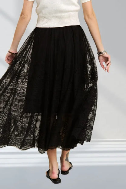 Black ADORA lace maxi skirt with elastic waist and raw hem, stylish and flowy women's fashion by Trendsi.