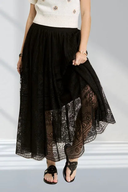 Black ADORA elastic waist lace maxi skirt with raw hem, featuring a flowy design and stylish details.