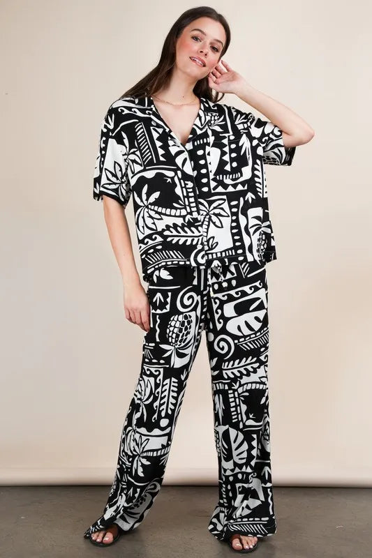 Black Very J printed casual wide-leg resort pants from Trendsi, featuring a relaxed fit and comfortable design.
