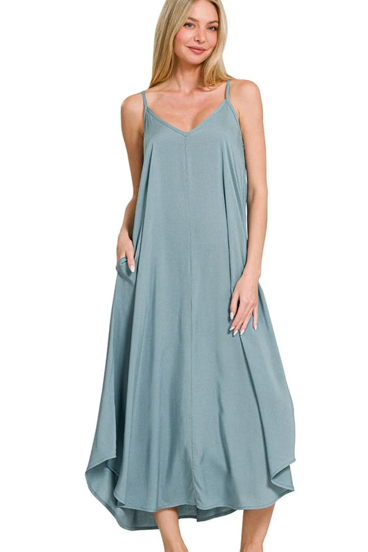 Blue-grey Zenana woven cami dress with arc hem and flowy pockets, stylish and comfortable for casual wear.