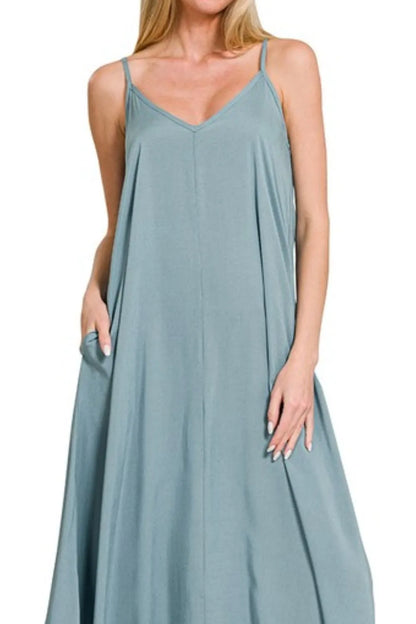 Blue-grey Zenana woven cami dress with arc hem and flowy pockets, featuring a stylish, casual design perfect for warm weather.