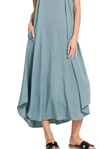 Blue-grey Zenana woven cami dress with arc hem and flowy pockets, featuring a stylish and comfortable design.
