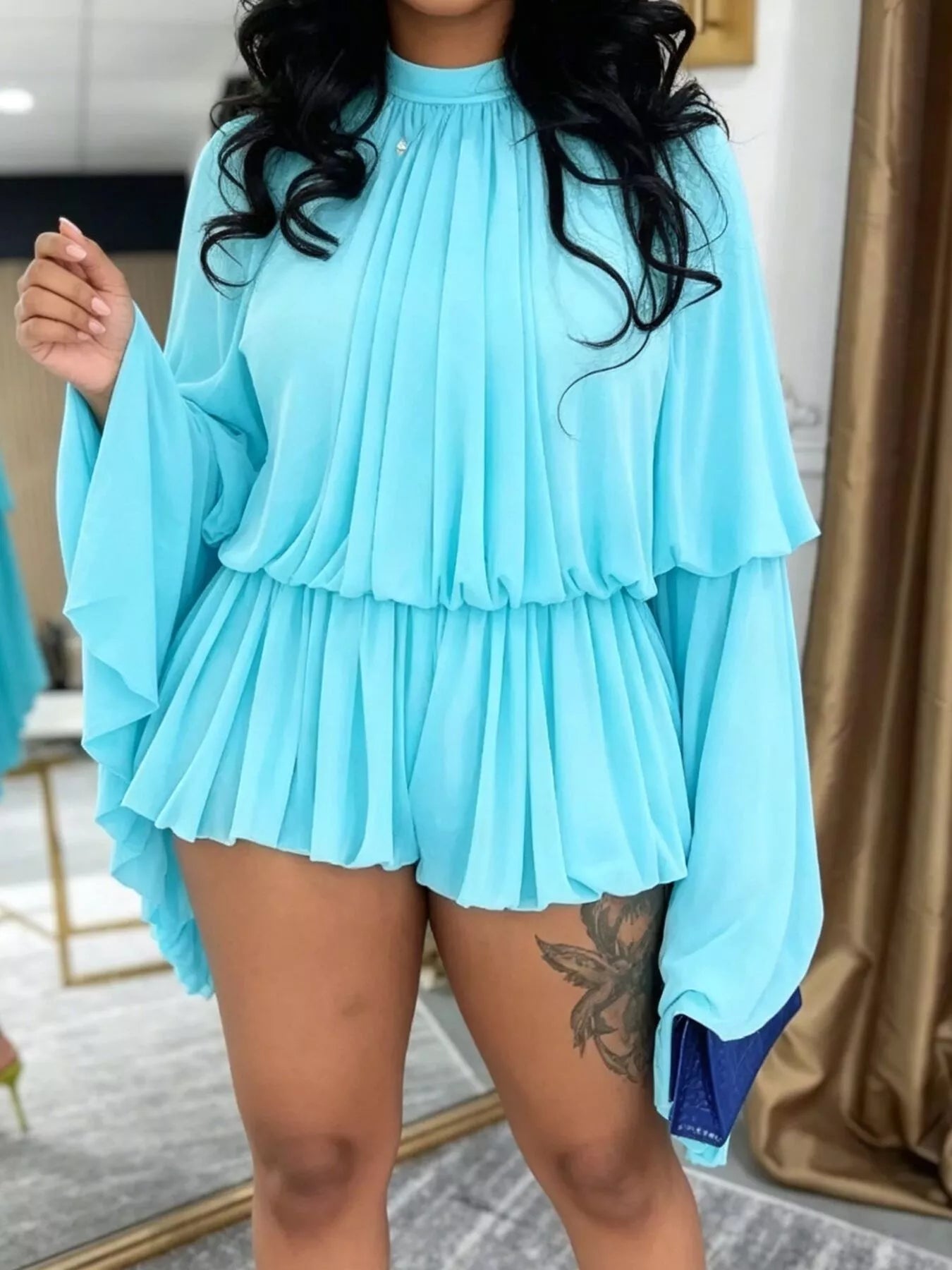Blue pleated long sleeve top and skirt set by Trendsi, featuring a stylish and coordinated fashion ensemble.