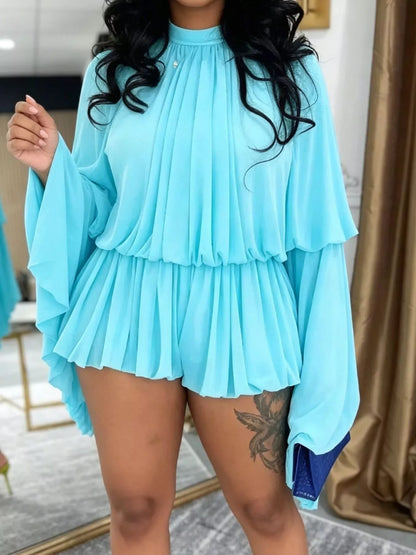 Blue pleated long sleeve top and skirt set by Trendsi, featuring a stylish and coordinated fashion ensemble.