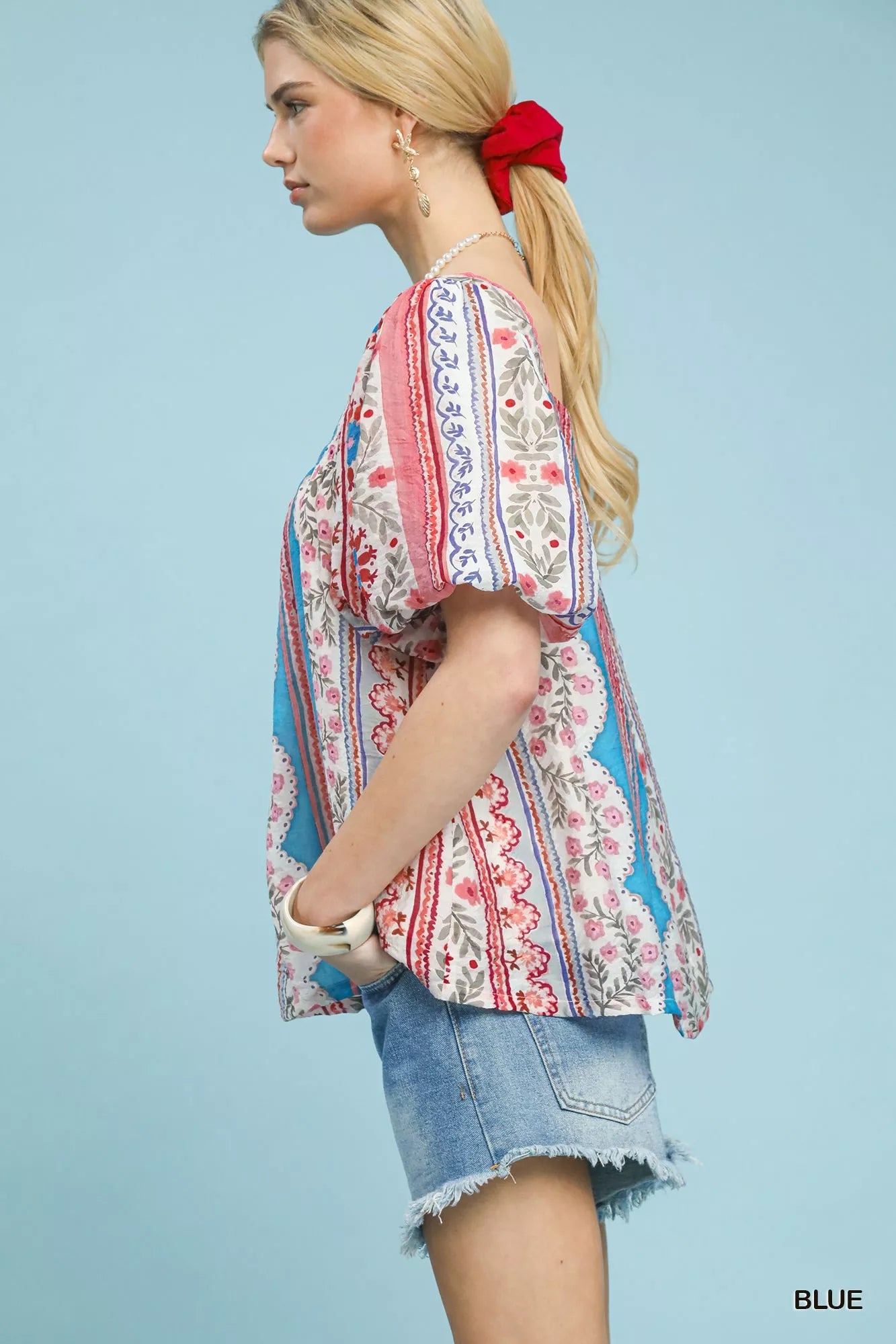 Blue Umgee patchwork puff sleeve smocked blouse with intricate design, featuring a stylish and comfortable fit.