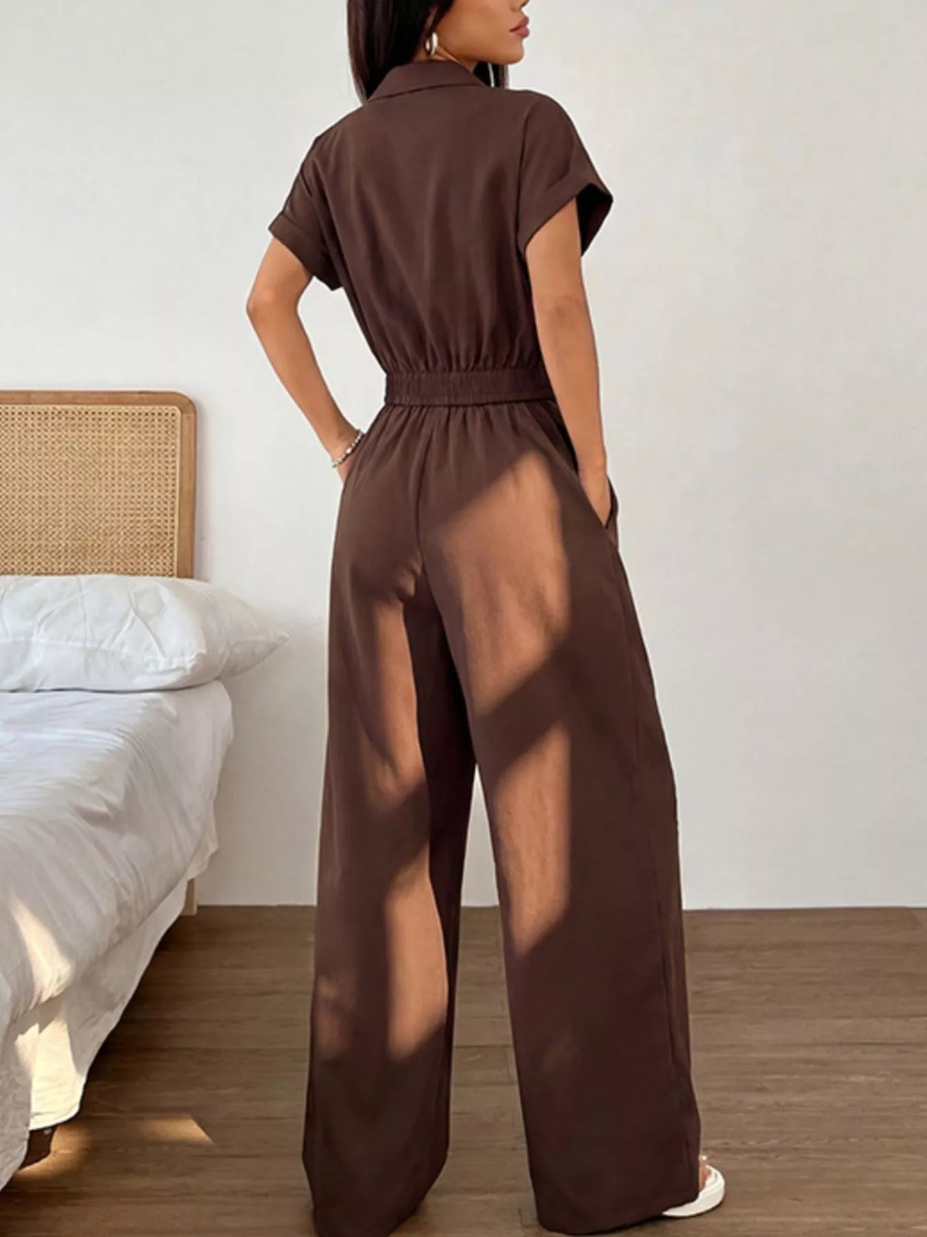 Brown cargo pocket zipper front jumpsuit by Trendsi, featuring a stylish design with functional pockets and a front zipper.
