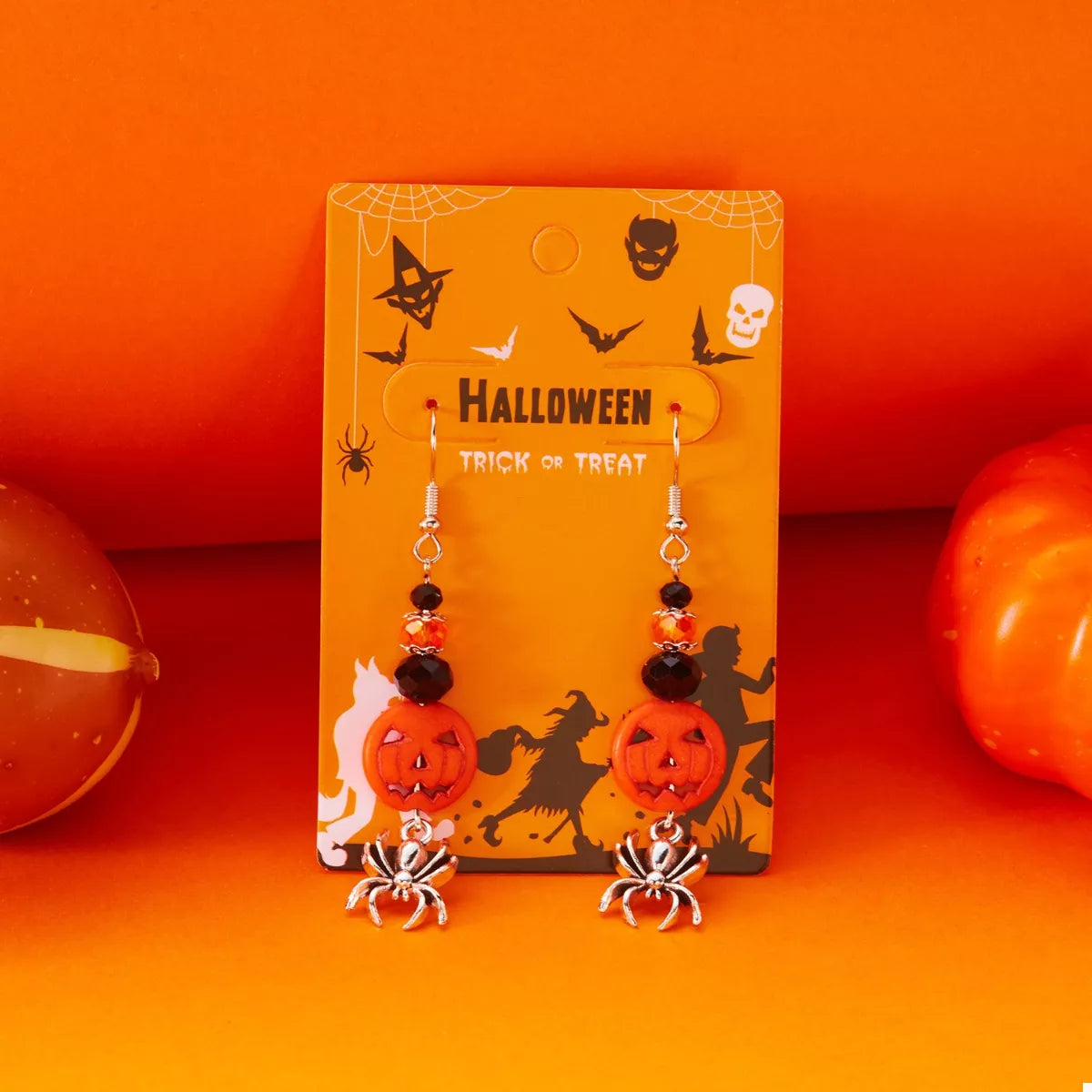 Halloween Spider Pumpkin Drop Earrings featuring spooky black spiders and orange pumpkin charms, stylish and festive jewelry.