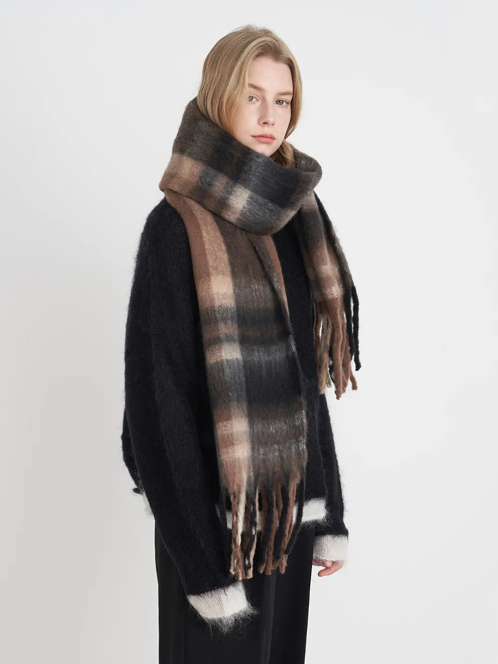 Fringe plaid polyester scarf from Trendsi featuring a classic tartan pattern and fringed edges, perfect for stylish winter accessories.