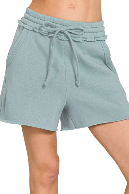 Zenana fleece raw hem shorts with drawstring, soft and comfortable, shown with casual styling.