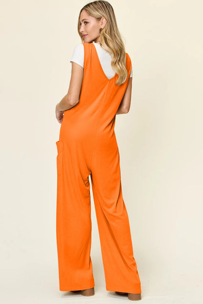 Plus size Trendsi Double Take sleeveless wide-leg jumpsuit with pockets, full size, casual style, black fabric, front view.