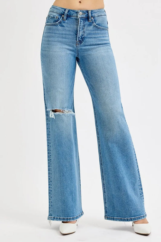 Plus size distressed wide leg jeans from RISEN by Trendsi, showing the full-length denim with a relaxed fit and distressed details.