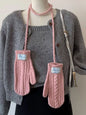Cable knitted mittens with neck strap from Trendsi, showing cozy, textured wool design and attached strap for warmth and style.