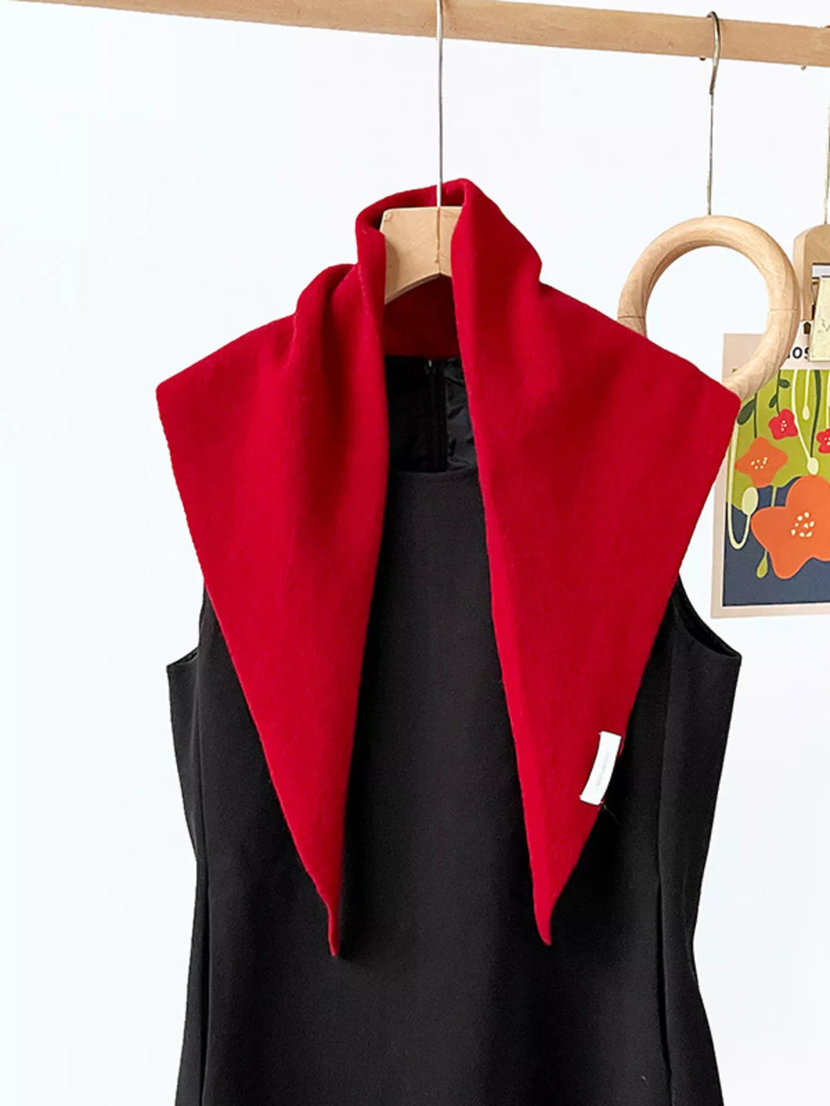 Solid color knit scarf by Trendsi featuring soft, cozy fabric and a classic design, perfect for adding warmth and style to winter outfits.