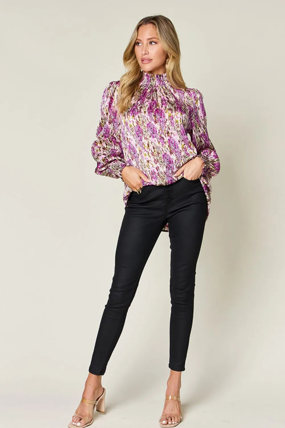 Printed smocked long sleeve blouse by Trendsi featuring a stylish design and full-length sleeves.