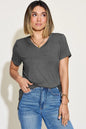 Basic Bae full size V-neck high-low T-shirt by Trendsi, shown in black with a relaxed fit and stylish drape.