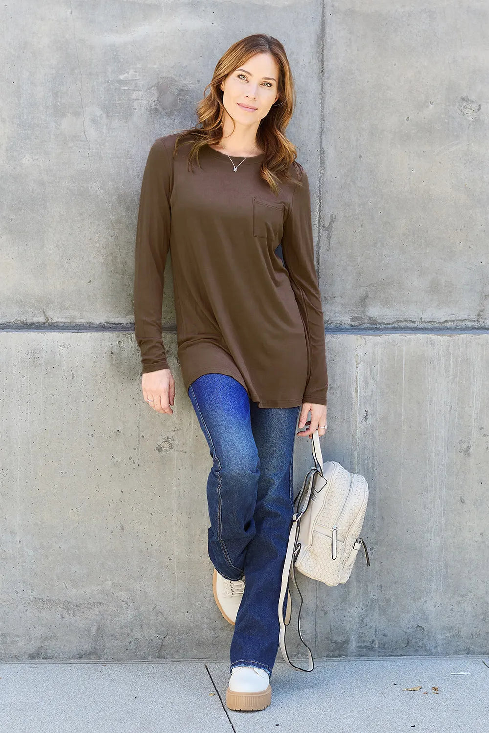 Basic Bae full size round neck long sleeve top from Trendsi, featuring a classic fit and soft fabric in a neutral color.