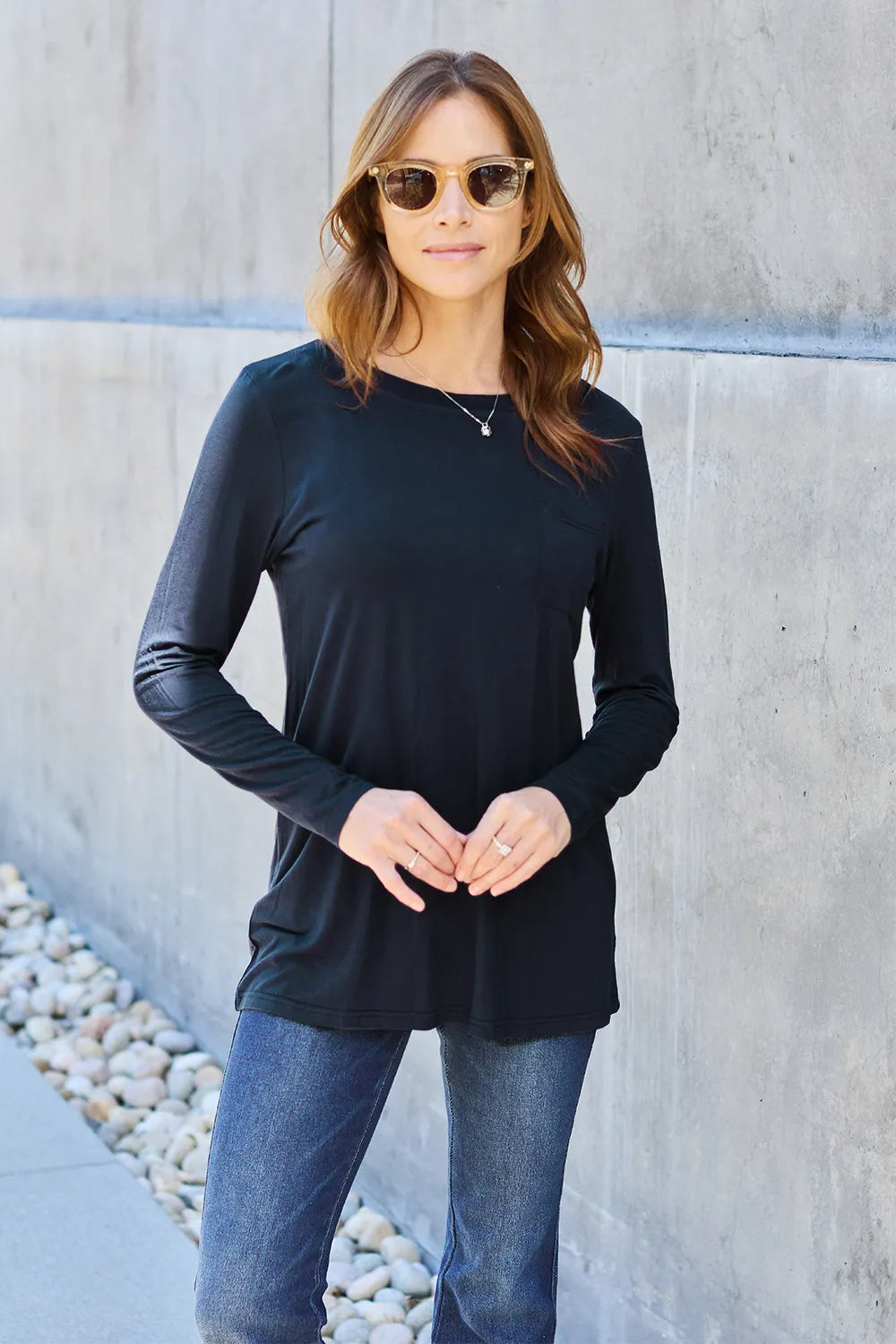 Basic Bae full size round neck long sleeve top by Trendsi, shown in beige with a relaxed fit and soft fabric.