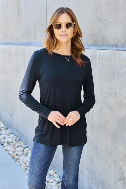 Basic Bae full size round neck long sleeve top by Trendsi, shown in beige with a relaxed fit and soft fabric.