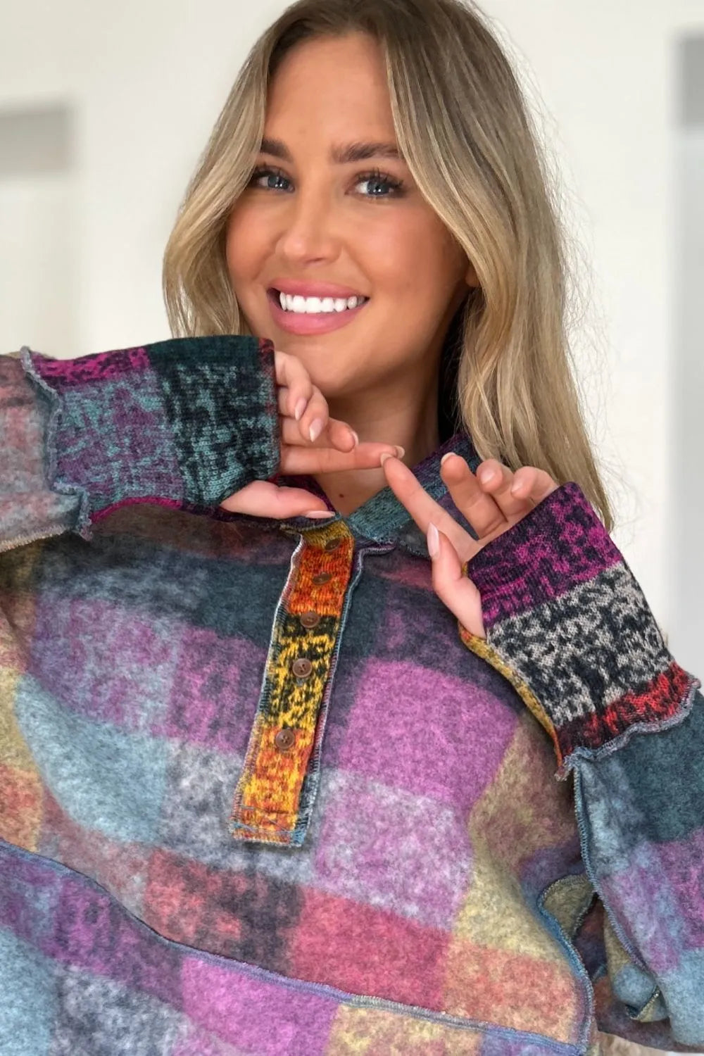 Plus size plaid fleece hoodie with dropped shoulders from Trendsi, featuring a cozy full-size fleece hoodie in a stylish plaid pattern.