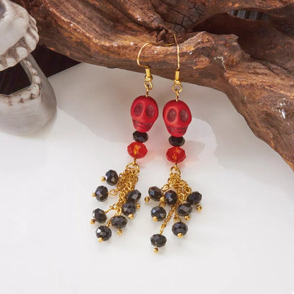 Halloween Skull Beaded Drop Earrings by Trendsi featuring black and orange skull and bead design for spooky style.