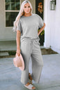 Trendsi Double Take full size textured short sleeve top and matching pants set, stylish and comfortable for casual wear.