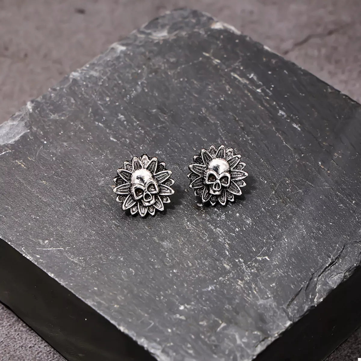 Halloween Skull Sunflower Stud Earrings by Trendsi featuring skull and sunflower design in a stylish metal finish.