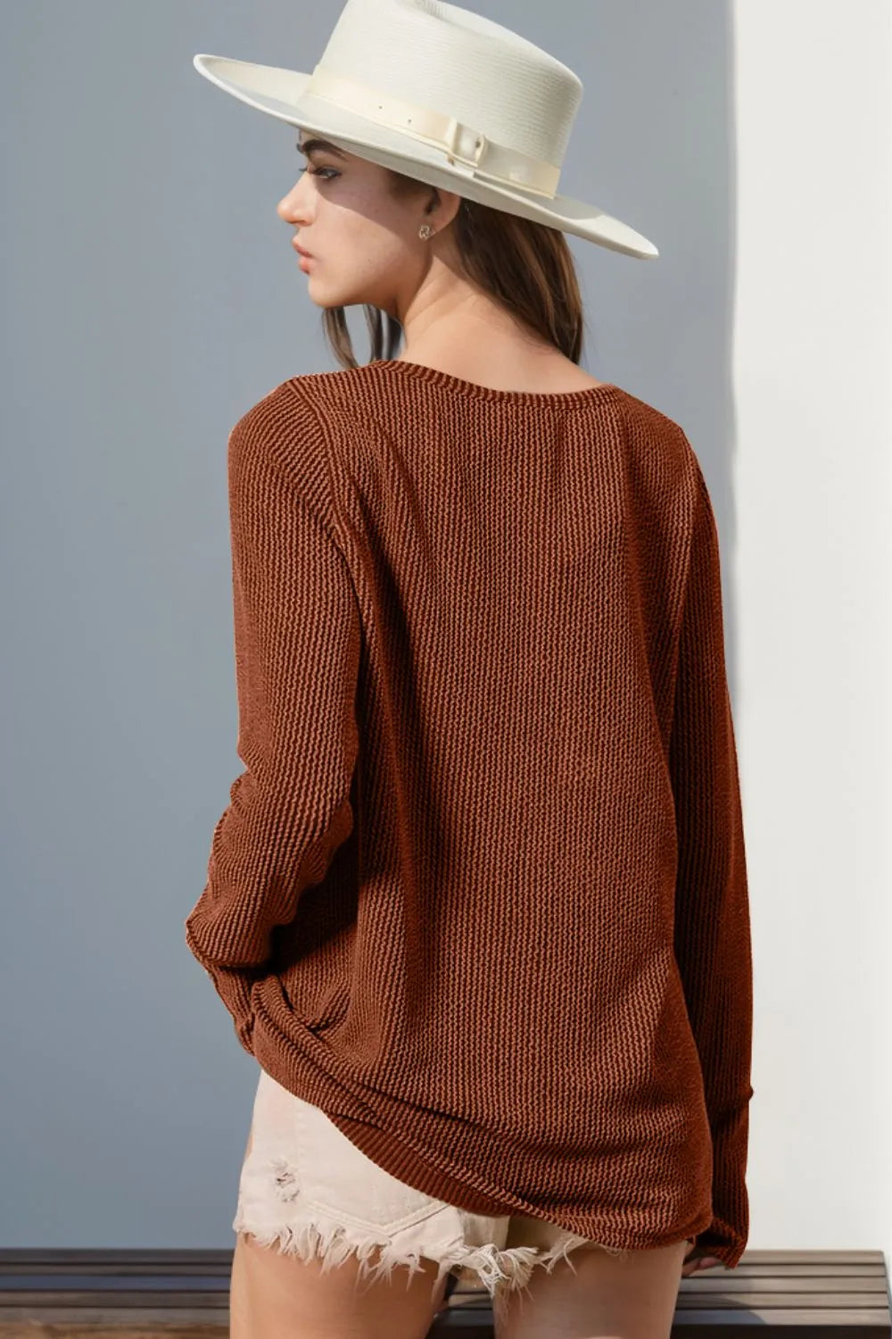 Long sleeve T-shirt with notched thumbholes, full size, in a casual fit, featuring a trendy design by Trendsi.