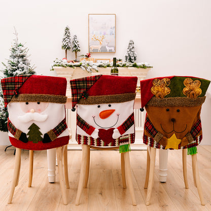 Red Christmas chair cover with festive patterns and trim, designed by Trendsi, draped over a chair for holiday decoration.