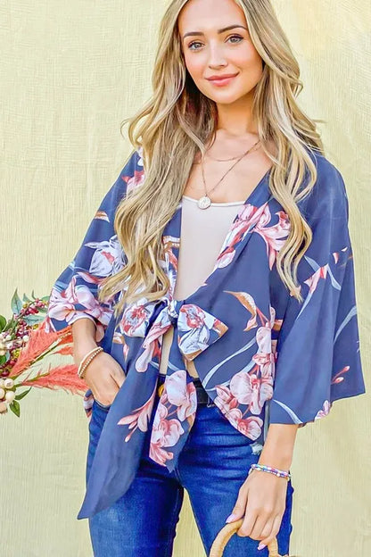 Charcoal floral print top with front tie knot from And The Why by Trendsi, featuring a stylish, casual design.