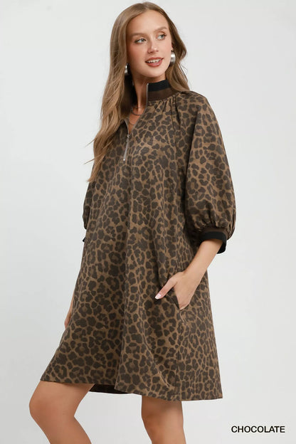 Chocolate leopard print Umgee mini dress with puff sleeves and quarter zip detail, stylish and trendy for casual wear.