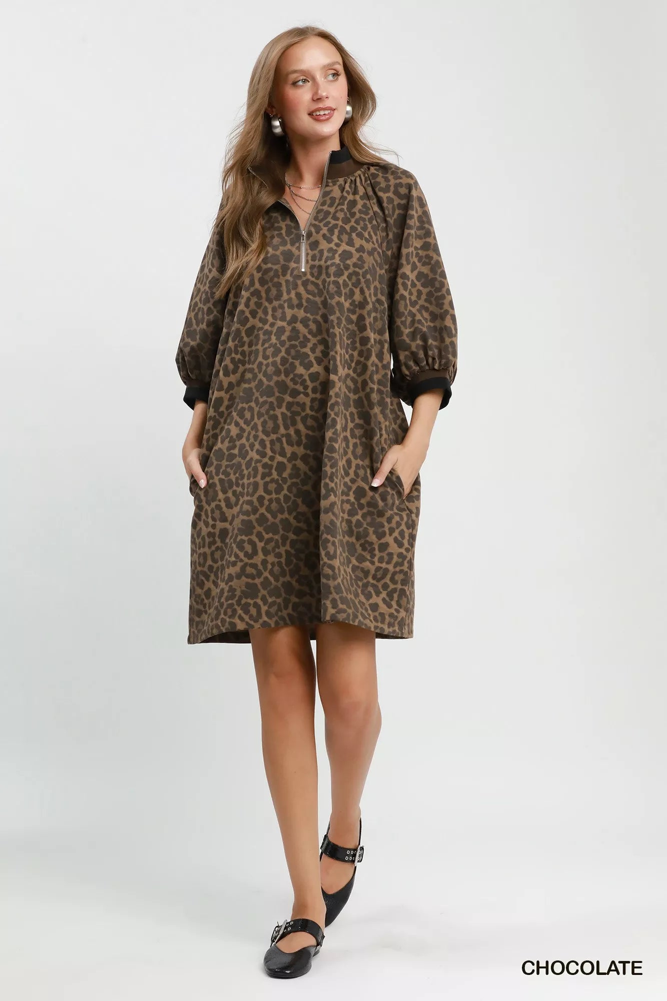 Chocolate brown leopard print Umgee mini dress with quarter zip and puff sleeves, perfect for casual or chic occasions.