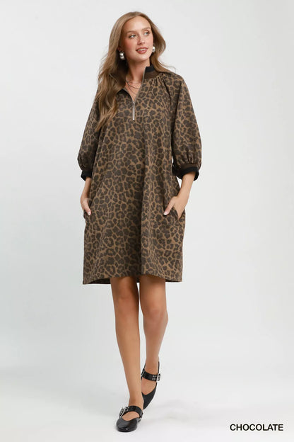 Chocolate brown leopard print Umgee mini dress with quarter zip and puff sleeves, perfect for casual or chic occasions.