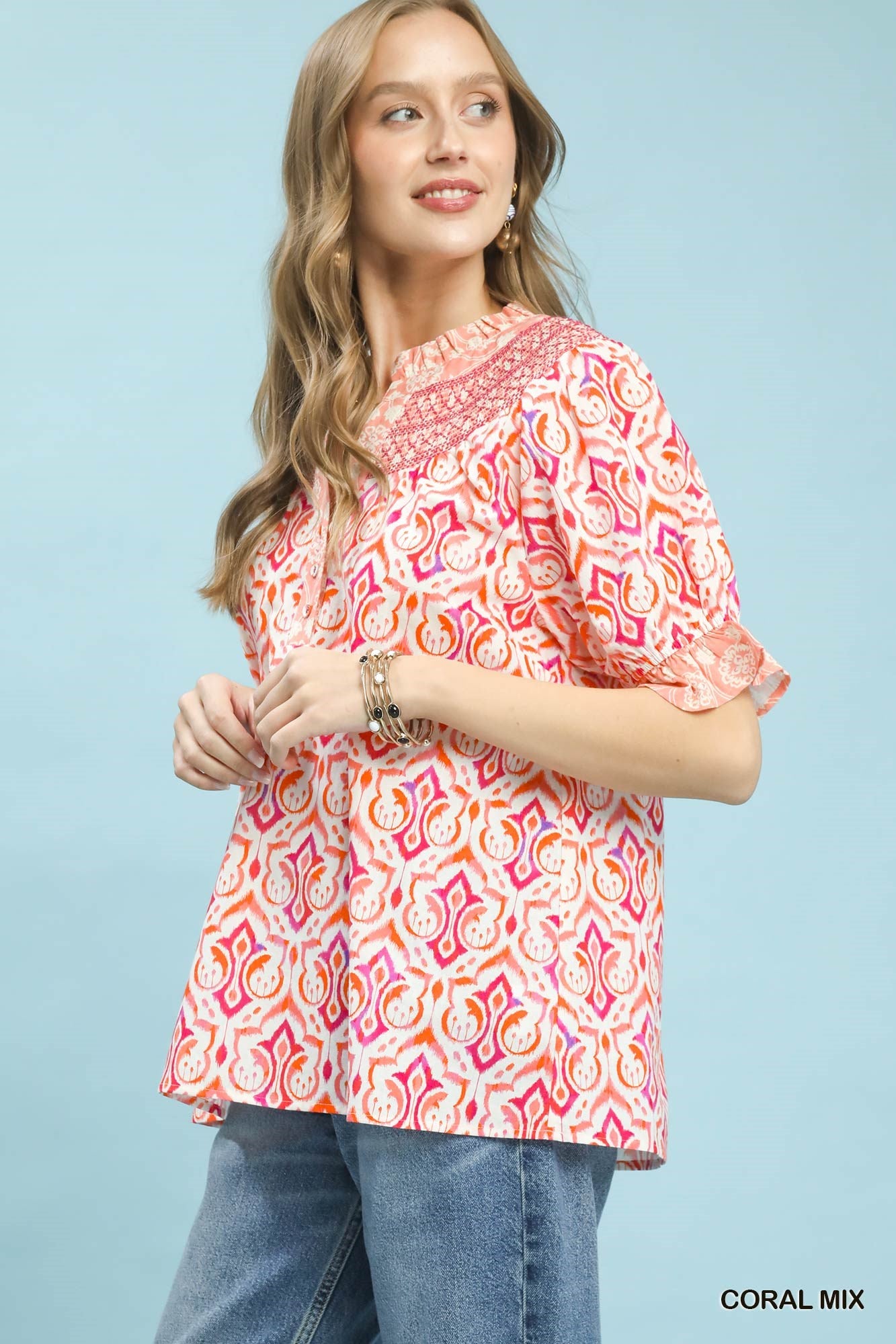 Coral mix boho puff sleeve smocked top by Umgee, featuring a relaxed fit and trendy design, perfect for casual wear.