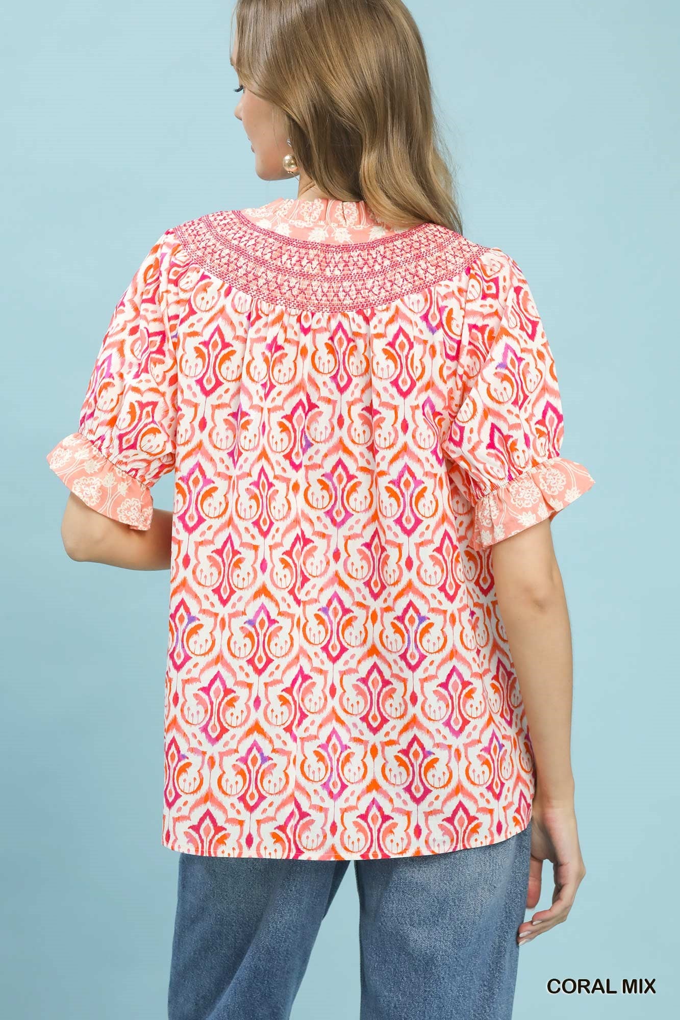 Coral mixed boho puff sleeve smocked top by Umgee, featuring a relaxed fit and stylish design, perfect for casual wear.