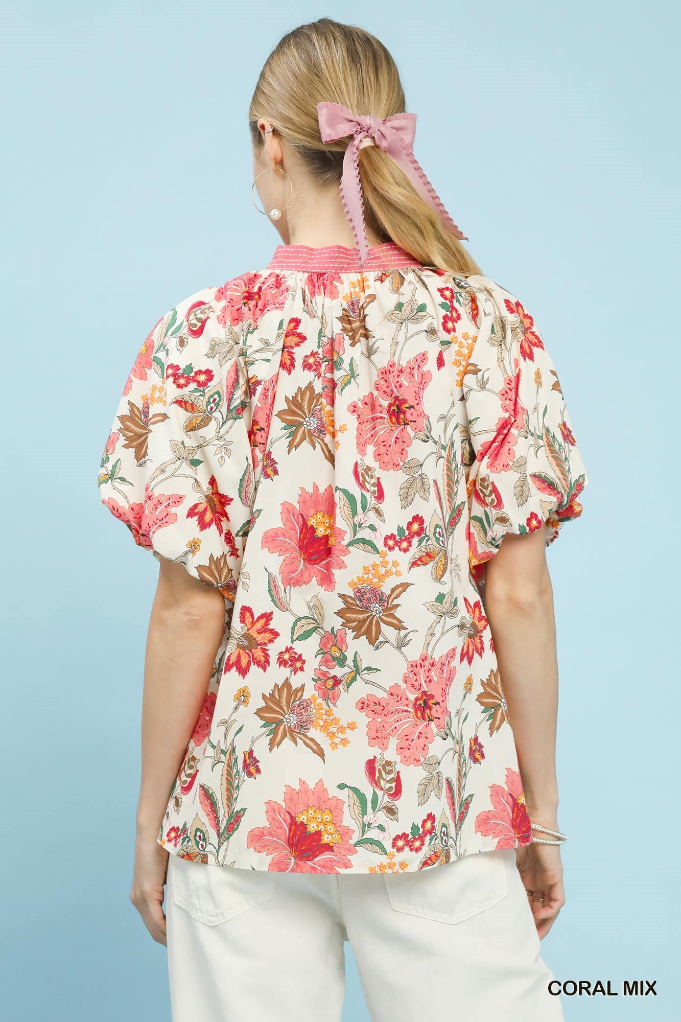 Coral floral puff sleeve blouse by Umgee with a mix of vibrant flower patterns and lightweight fabric, perfect for casual wear.