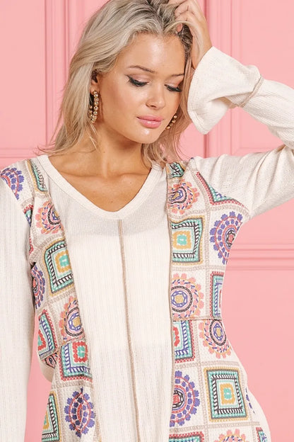 Cream Annie rib V-neck top with granny square print and contrast details from Trendsi, showcasing its stylish design and fabric texture.