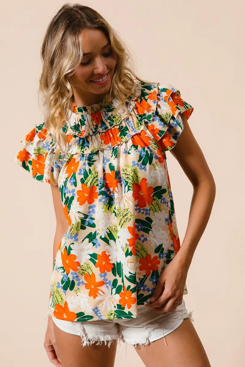 Cream woven top by Trendsi featuring a vibrant multicolor floral print and lightweight fabric.