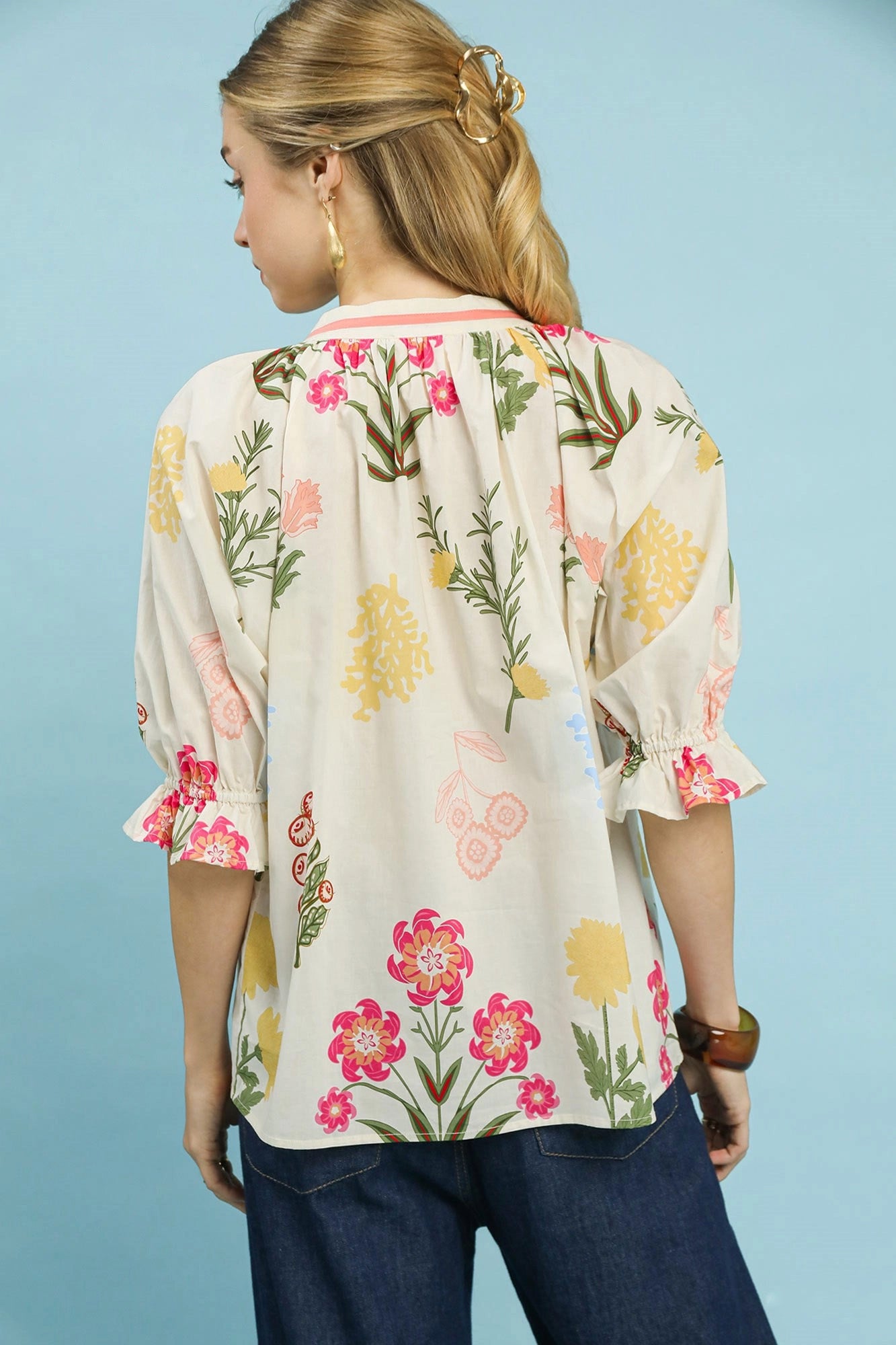 Cream floral split neck puff sleeve top by Umgee featuring a relaxed fit and feminine design.