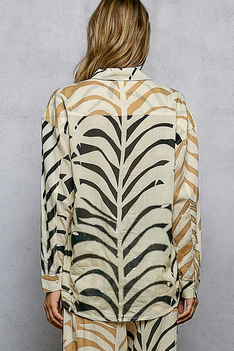 Cream zebra print long sleeve woven shirt with two-tone design and spangle accents by Trendsi