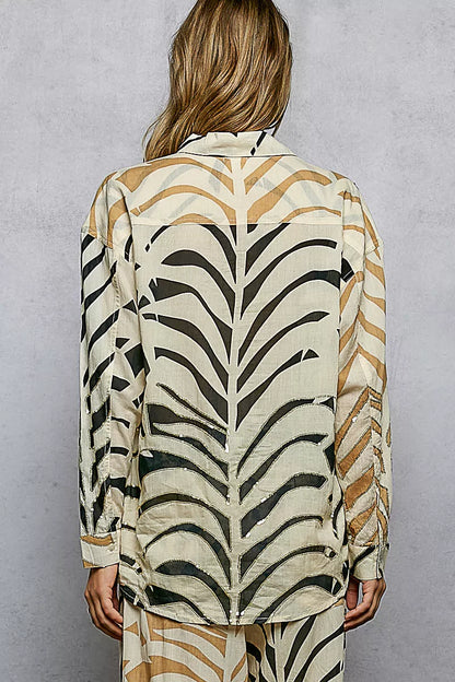 Cream zebra print long sleeve woven shirt with two-tone design and spangle accents by Trendsi