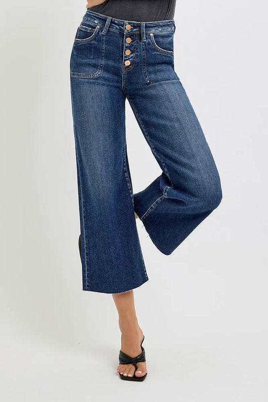 Plus size RISEN high-rise crop wide-leg jeans with front buttons, styled for a trendy casual look.