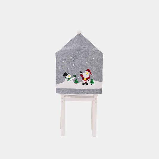 Christmas pattern chair cover from Trendsi featuring festive red and green holiday motifs on a fabric chair cover.