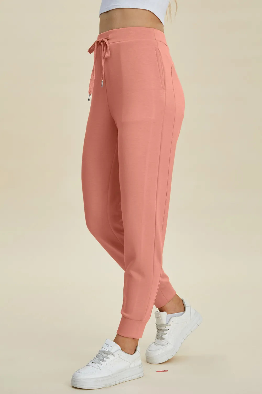 Basic Bae high waist scuba joggers by Trendsi featuring drawstring waist and full length in black fabric.