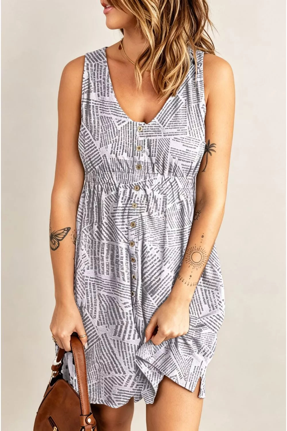 Printed sleeveless casual dress with front buttons, ruched waist, side slit, pockets, from Trendsi's Double Take collection.