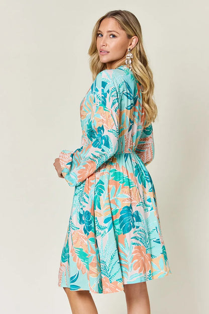 Printed V-neck drawstring dress from Trendsi featuring a full-size, casual, comfortable design with a stylish floral pattern.