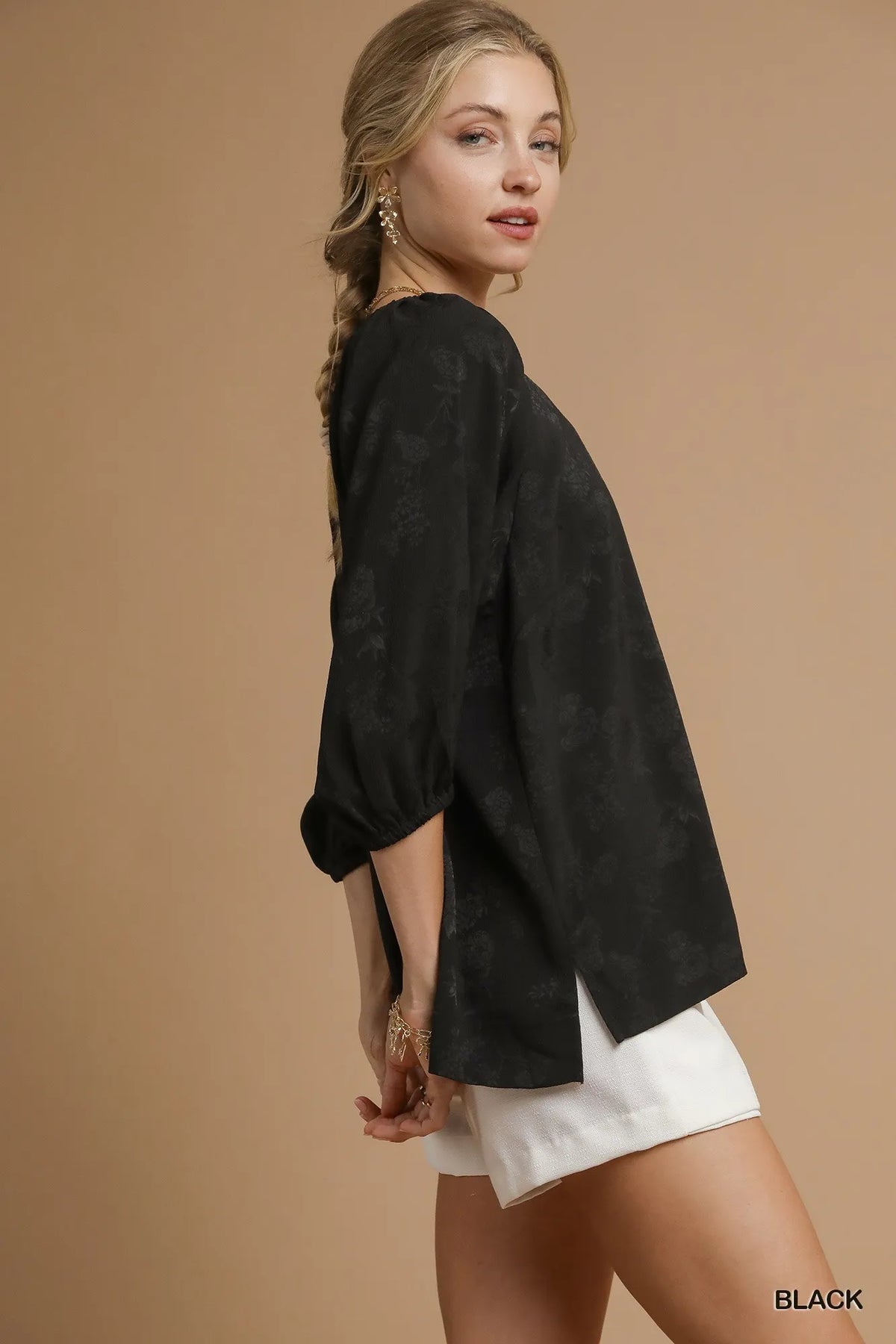 Satin jacquard balloon sleeve blouse by Umgee featuring intricate fabric pattern and stylish, puffed sleeves.